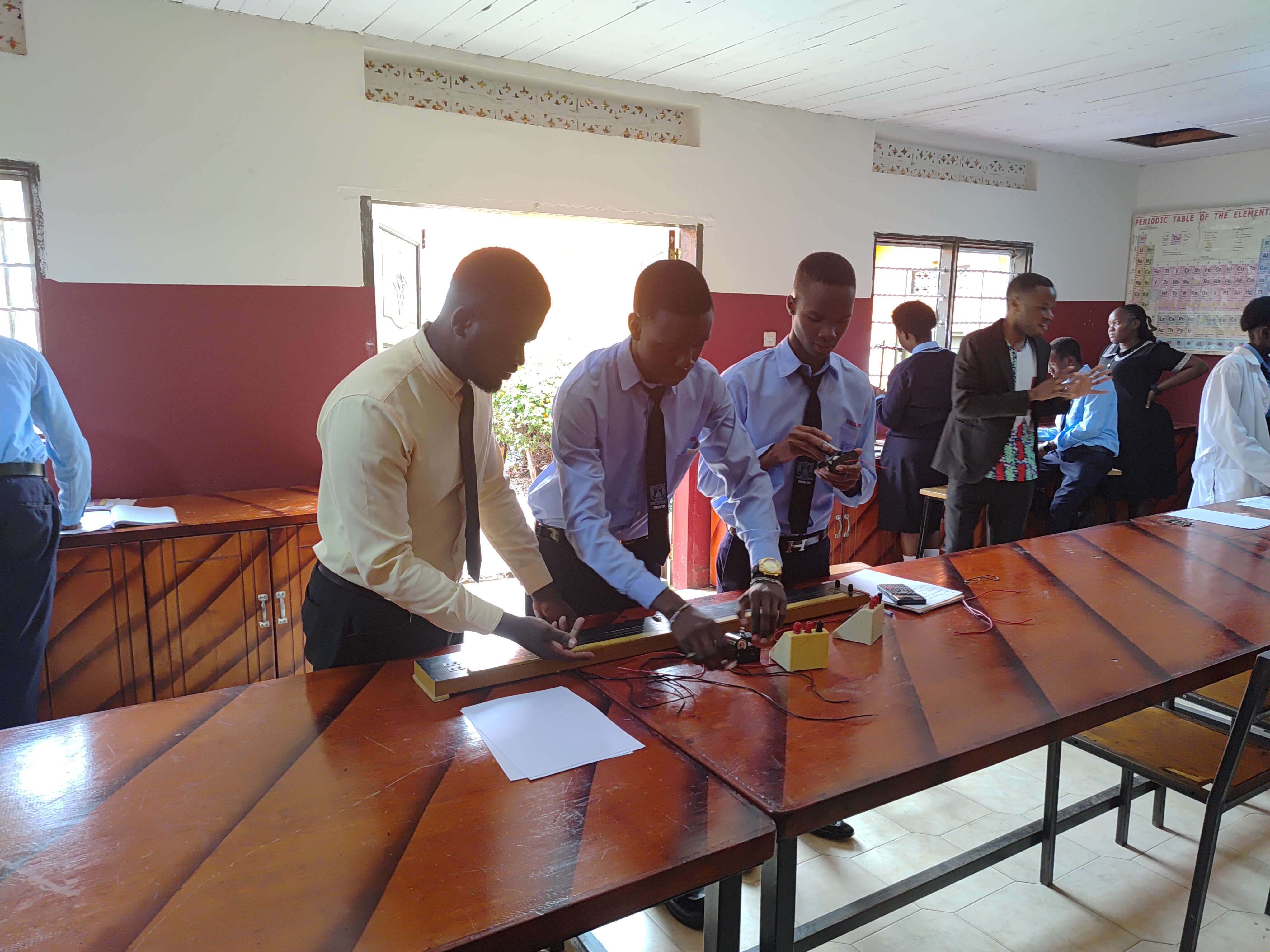 Physics student setting up laboratory apparatus.